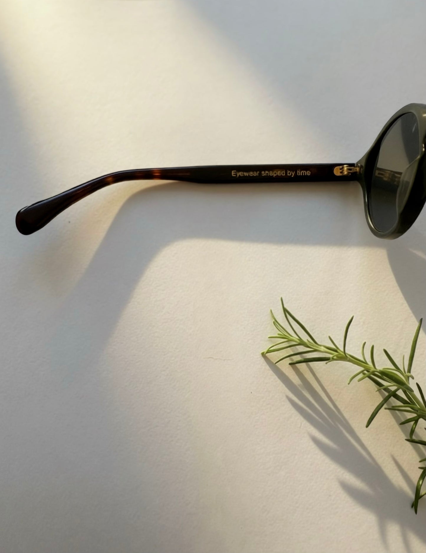 Side profile of Archive No.3 olive green sunglasses featuring Eyewear Shaped by Time temple engraving and premium craftsmanship.