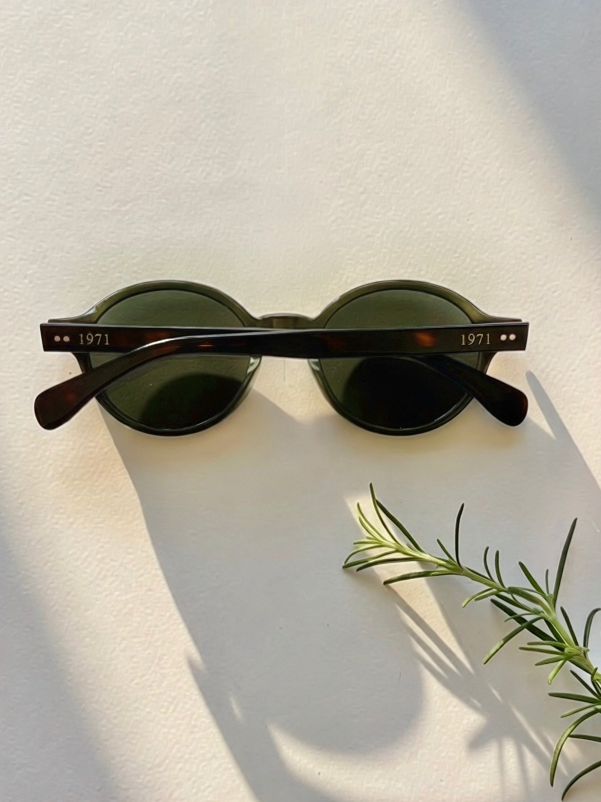 Rear view of Archive No.3 olive green sunglasses showcasing signature 1971 Studio temple branding and handcrafted frame details.