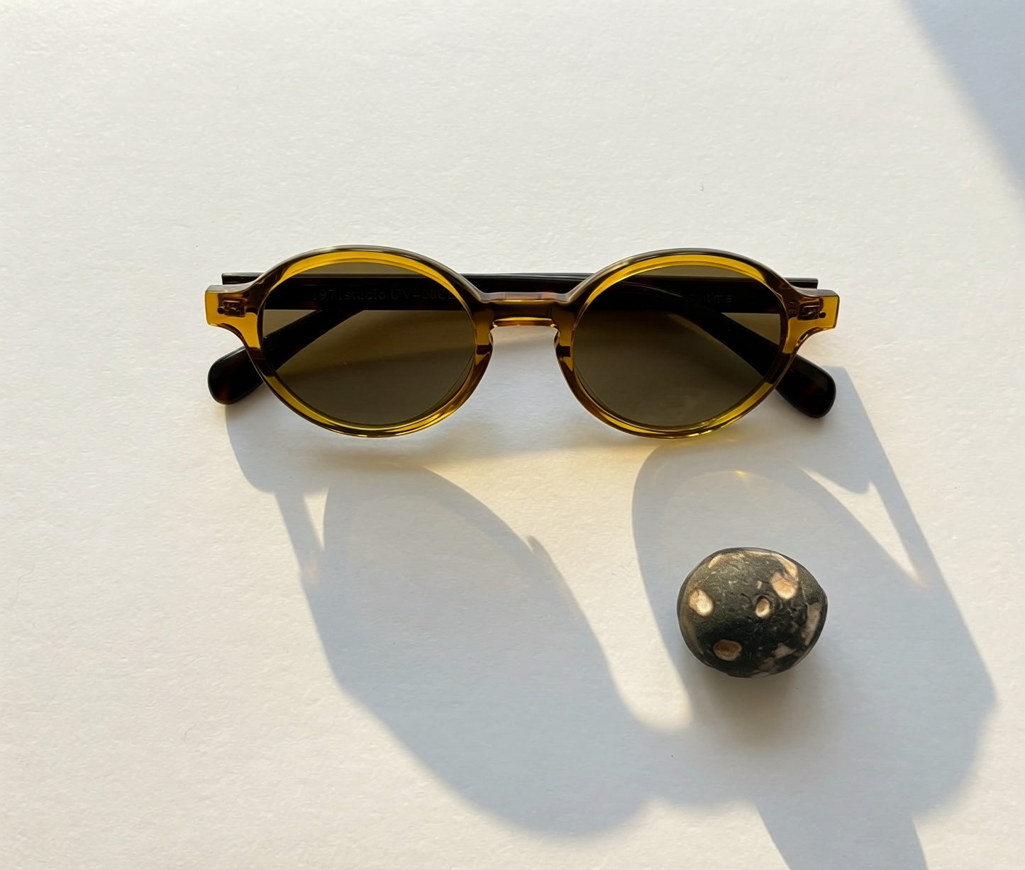 Archive No.2 Amber round sunglasses by 1971 Studio featuring translucent amber frames, UV400 lenses, and a timeless vintage-inspired design.
