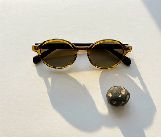 Archive No.2 Amber round sunglasses by 1971 Studio featuring translucent amber frames, UV400 lenses, and a timeless vintage-inspired design.